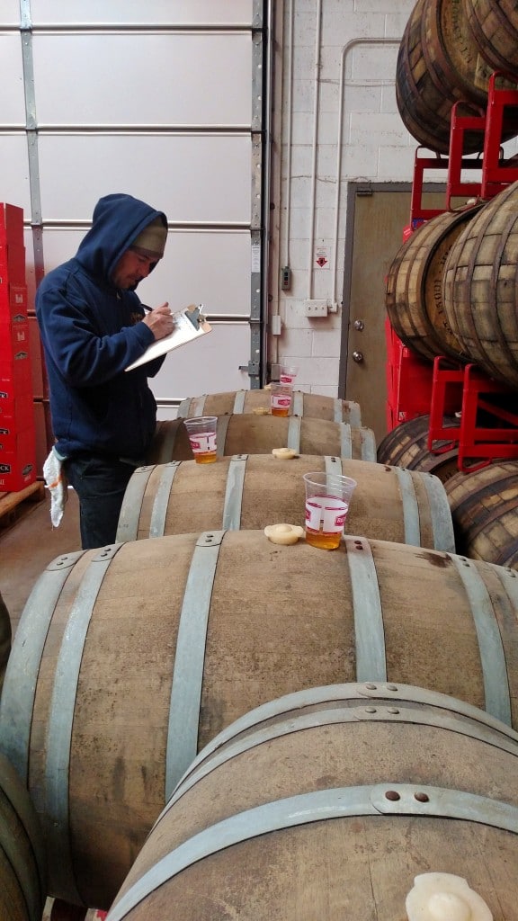 Brewmaster Kevin Templin takes notes on barrel samples.